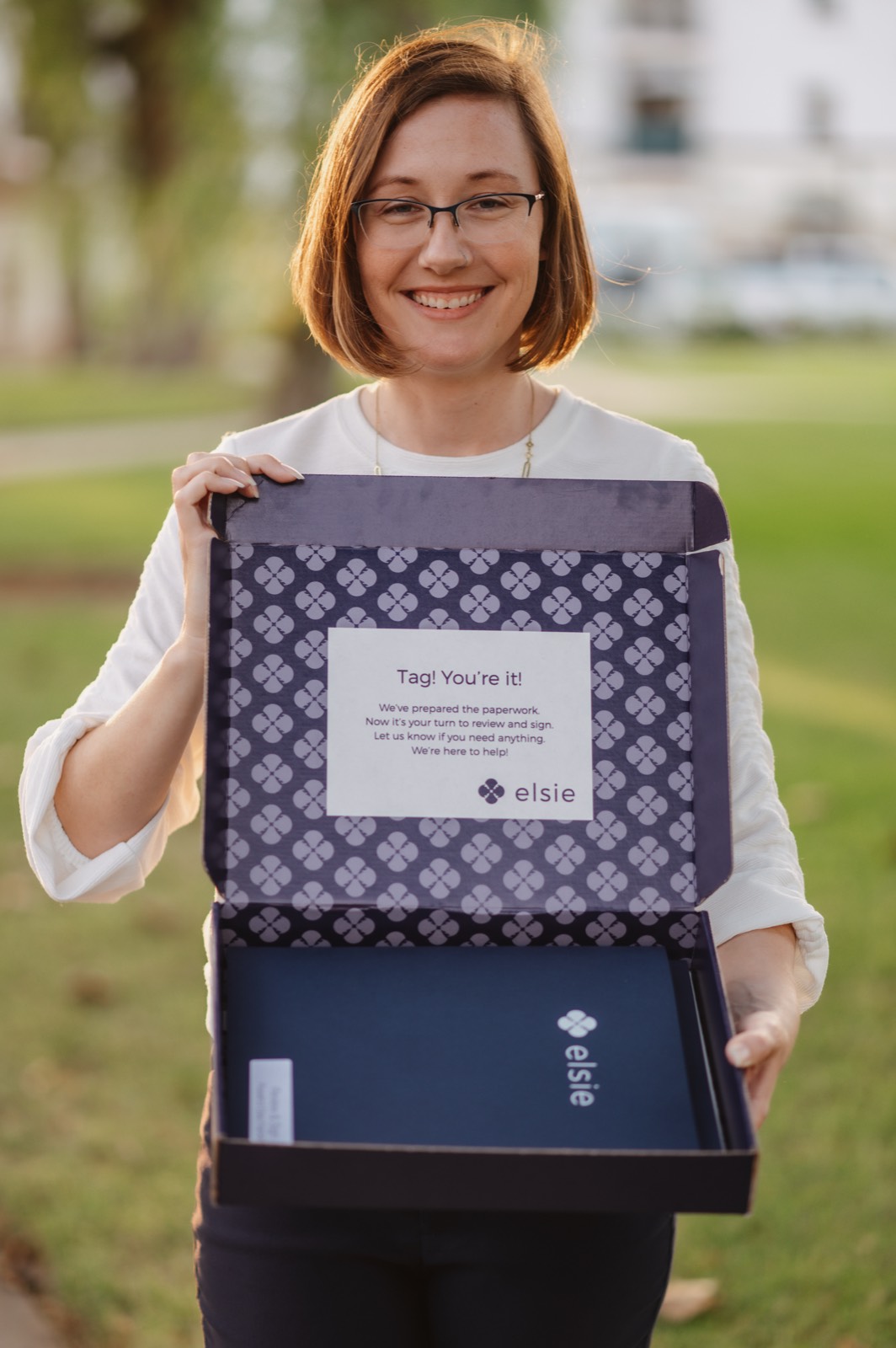 Genetic counselor holding an open Elsie licensure box